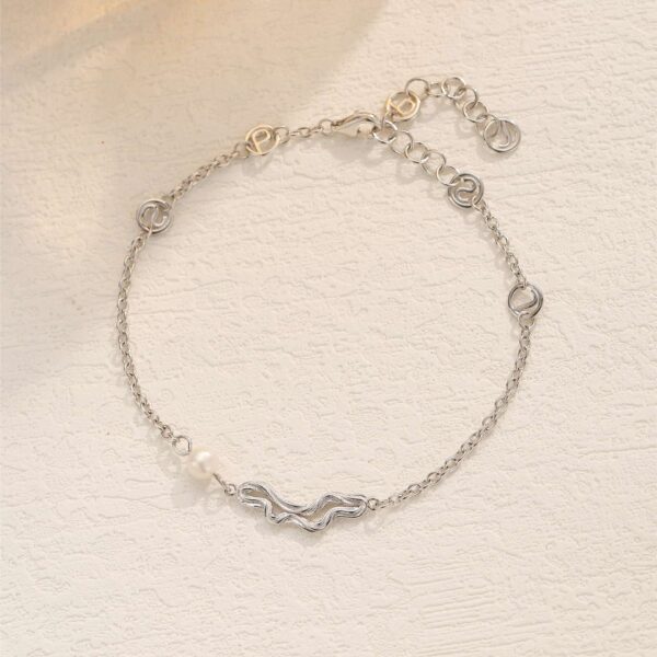 Butti armbånd RH – rhodineret sølvarmbånd med perle fra Spinning Jewelry